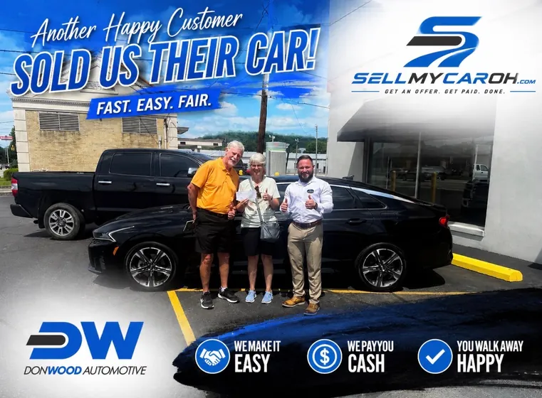 Happy couple who sold their black sedan for cash — fast, easy, fair