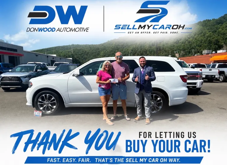 Couple who sold their white Dodge Durango to SellMyCarOH for cash