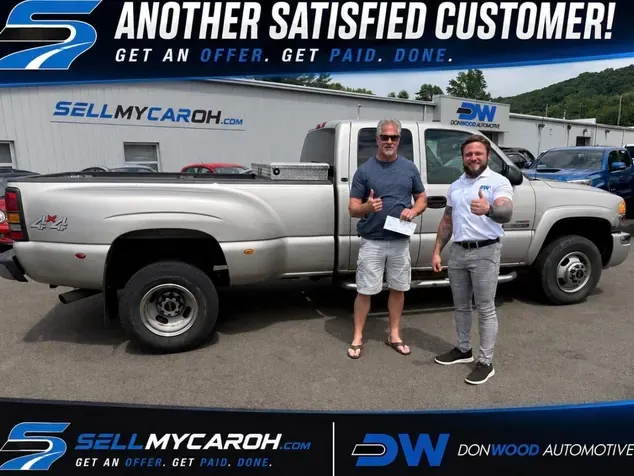 Satisfied customer selling his GMC dually truck at the SellMyCarOH lot