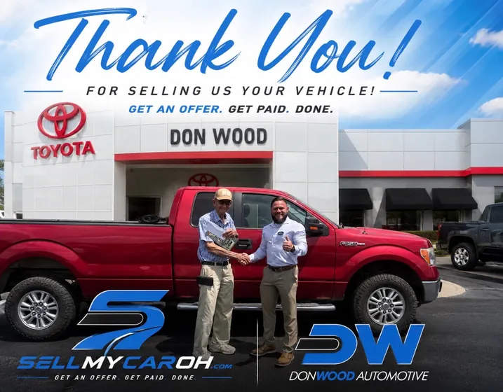 Customer shaking hands after selling his red Ford F-150 at the Don Wood buying center in Athens, Ohio